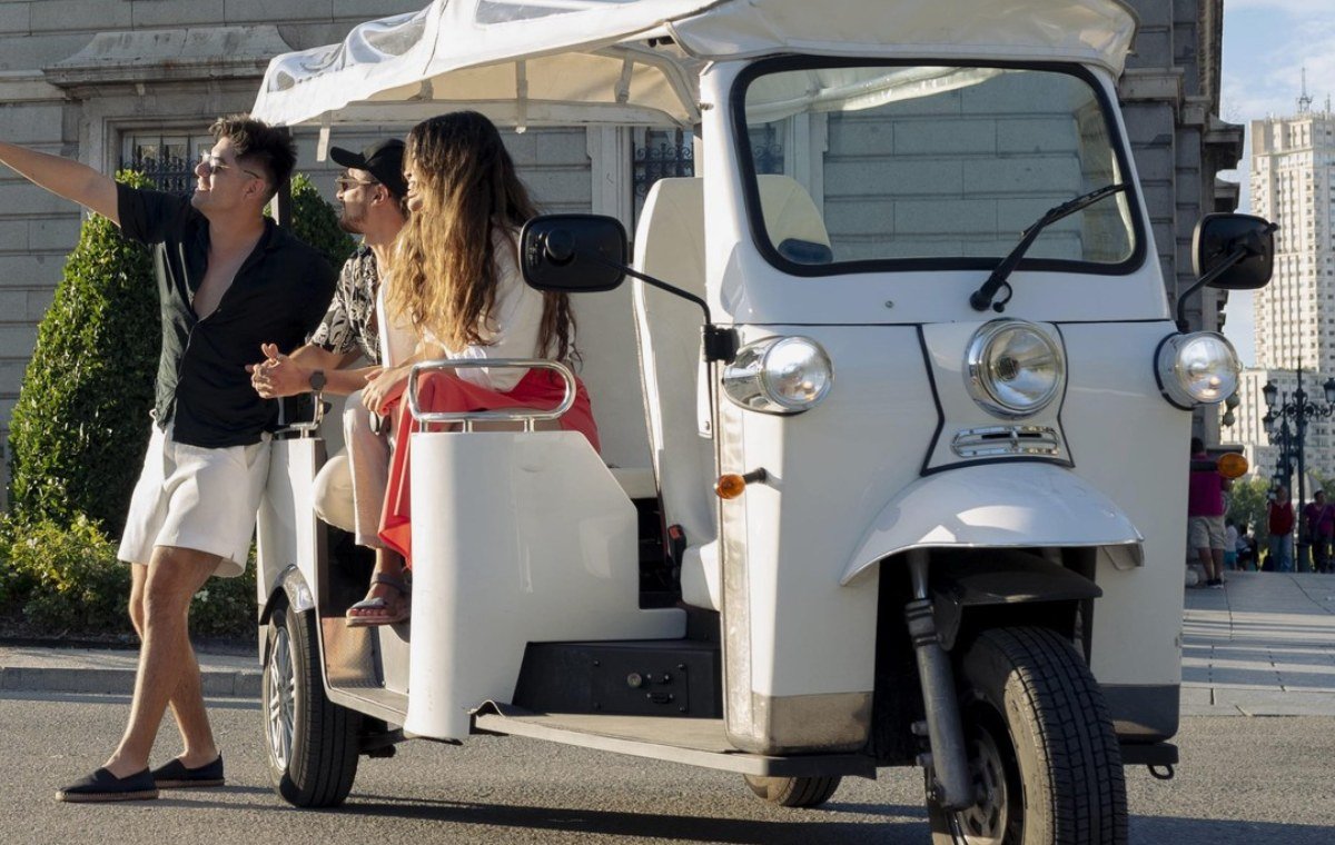 Tuk tuk tour stopped at Puerta del Sol's Kilometre Zero marker in central Madrid